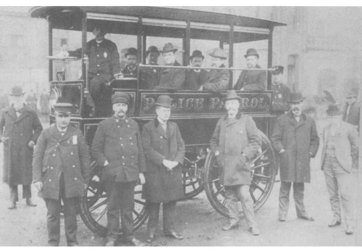 The term 'squad car' likely came from early patrol days, when agencies used wagons to transport the whole squad. Image via Akron Police Department.