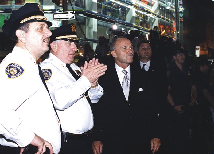 NYPD commissioner Raymond Kelly (in suit and tie) walks Broadway with some of his staff officers.
