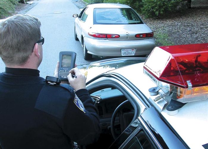 Example of handheld computers in the field. Panasonic PDA at traffic stop.