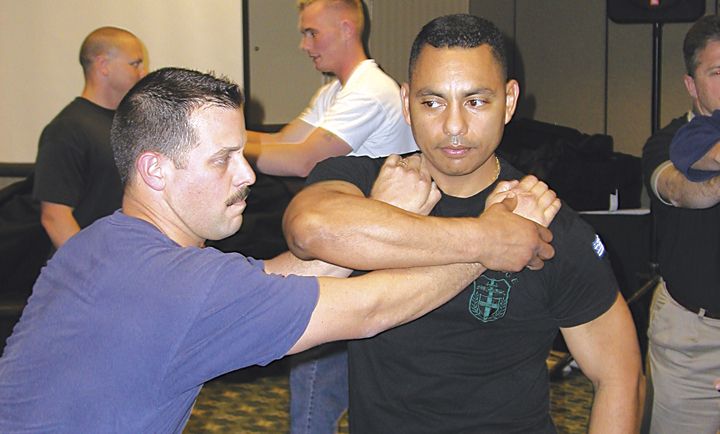 Martial arts instructor Hans Marrero demonstrates a suspect control technique during a defensive tactics seminar at TREXPO West.