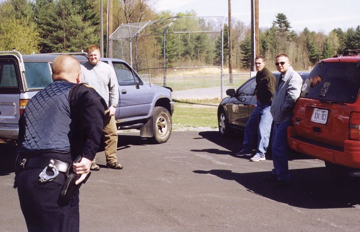 In this training scenario, the officer is at a disadvantage because he can’t draw his weapon until the bad guys make their moves.