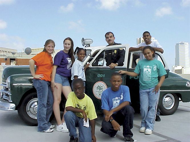 The “Do the Right Thing” program fosters partnerships between police officers, kids and the community. Recent winners gathered for a snapshot with their chief of police. Standing, from left, Renee Stoodt, Dianna Monteigas, Asia Cunningham, Chief Raul Martinez, Christopher Cruz, Elouise Johnson; kneeling, from left, Tyrell Lawson and David Floyd III.