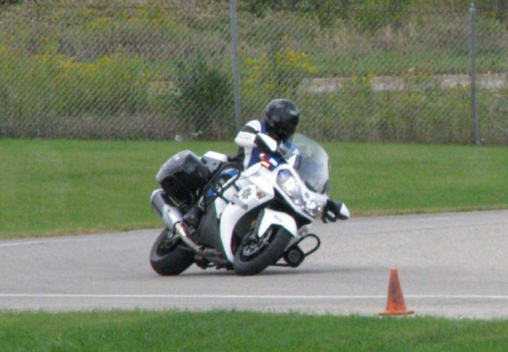 A trooper with the Michigan State Police Precision Driving Unit runs the Kawasaki Concourse 14 ABS P through a curve during annual vehicle tests. Photo courtesy of Kawasaki.