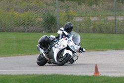 A trooper with the Michigan State Police Precision Driving Unit runs the Kawasaki Concourse 14 ABS P through a curve during annual vehicle tests. Photo courtesy of Kawasaki.