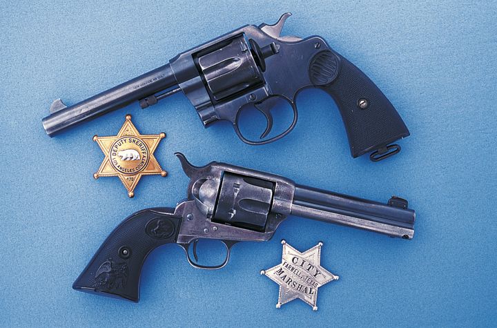 Along with two law enforcement badges, Deputy Grady Pardue’s Colt .45 six-shooters remain together after almost a century. The Colt New Service (top gun) was used by Grady to kill two armed robbers in a gunfight in Arcadia, California just prior to World War II.