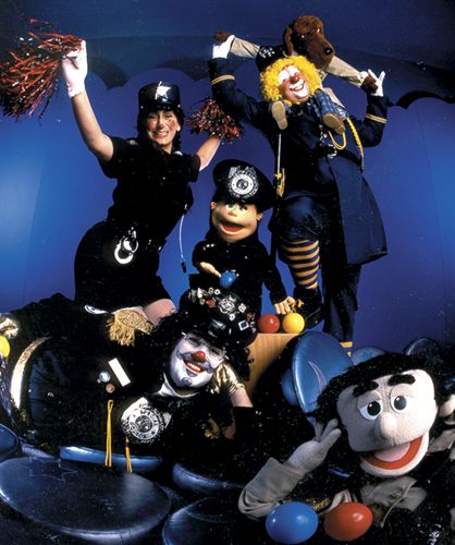 Members of S.M.I.L.E. (“Safety, Magic in Law Enforcement”) use magic, laughter and fun to raise kids’ awareness of safety and violence prevention.