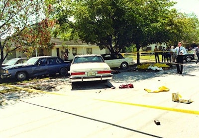 Crime scene photo of the infamous FBI Miami shootout, showing suspect and agents' vehicles and battle debris. Photo: Miami-Dade PD.