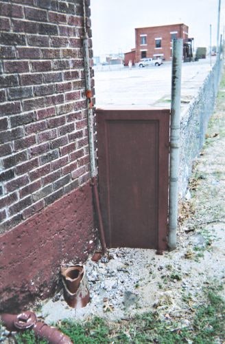 You can still see a bullet hole on the bottom right of this metal plate the suspect was positioned in front of. Photo: Steve Downie.