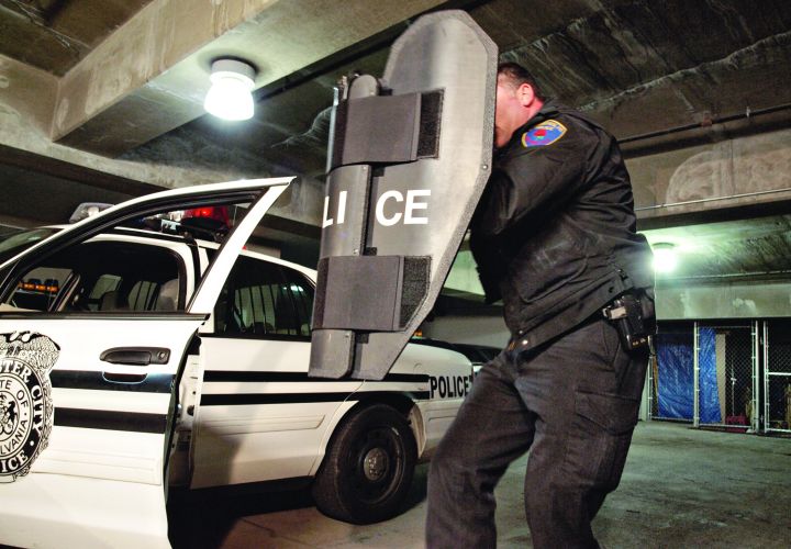 Ballistic shields such as the Baker PatrolBat are designed to fit in a patrol officer's car and can be carried while shooting solo. Photo: Mark W. Clark.
