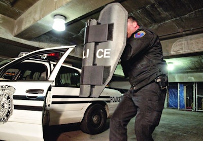 Ballistic shields such as the Baker PatrolBat are designed to fit in a patrol officer's car and can be carried while shooting solo. Photo: Mark W. Clark.