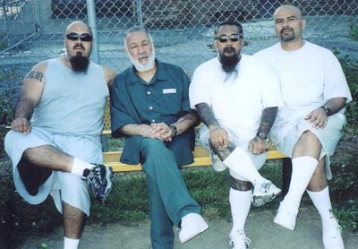 Peter 'Sana' Ojeda (second from l.) is seen in federal prison with his Mexican Mafia 'carnals' (brothers). Photo: Richard Valdemar.