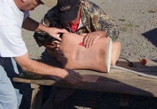 Applying a wound closure. Photo: Scott Smith