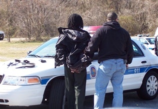 One of the Correctional Officers being arrested outside the PGDOC. Photo: Tony Avendorph