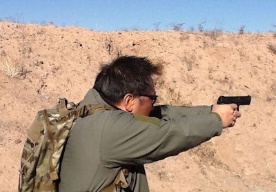 A media day participant shoots the HK45 Compact Tactical.