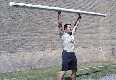 You can use a PVC pipe filled slightly with water to perform a shoulder press. Photo: Kevin Chimento