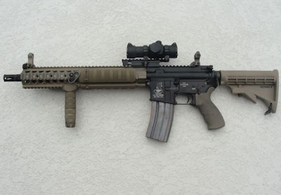 A 2012 AR-15 patrol rifle now comes with a 1913 quadrail, back-up iron sights, co-witnessed optic, vertical foregrip, QD sling swivels, and proprietary flash hider. Photo: Bob Parker