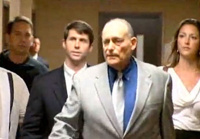 Special Agent Chris Deedy (second from left) appears in court on murder charges. Screenshot via KITV.