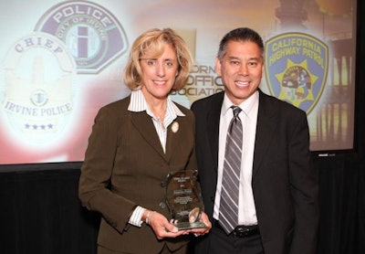 CHP Commissioner Joe Farrow congratulates Assistant Commissioner Ramona Prieto. Photo: Andrew Zelinko, Irvine Police Department