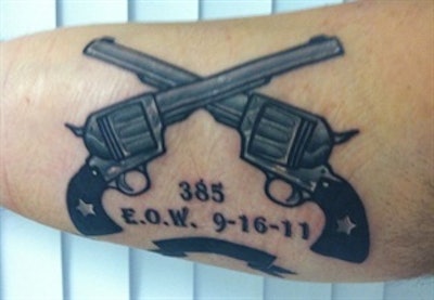 crossed pistols tattoo