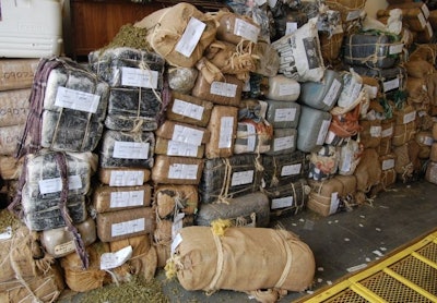 Mexican drug cartels smuggle marijuana into the U.S. in bundles like these. Photo by Paul Clinton.
