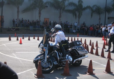 Sanford (Fla.) PD's Officer Tina Leman weaves through traffic cones on her H-D Electra Glide at a training rodeo. Photo courtesy of Officer Tina Leman.