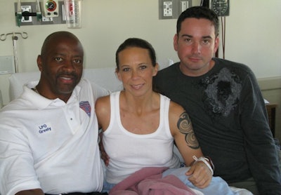 Kim Munley with husband Matt (right) and Walt Greely. Photo via AFGE/Flickr.