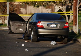 Photo of drive-by shooting is illustrative and via Chris Yarzab/Flickr.