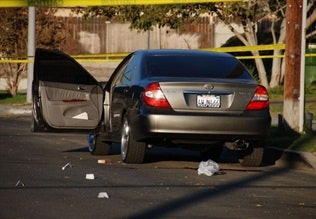 Photo of drive-by shooting is illustrative and via Chris Yarzab/Flickr.