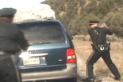 Officer Elias Montoya (foreground) prepares to fire upon the minivan as it drives away from officers. (Photo: Still from New Mexico State Police Video)