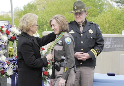 Then-governor Christine Gregoire presented the Washington Law Enforcement Medal of Honor to Deputy Krista McDonald of the Kitsap County (Wash.) Sheriff's Office. Photo courtesy of Kitsap County SO.
