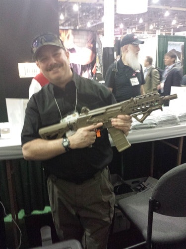 Retired officer and Police Magazine contributor Gerard Zlotkowski holds a new AK variant at SHOT Show 2014.