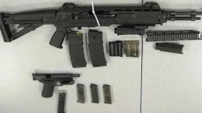 Photo released by the San Bernardino (Calif.) Sheriff's Department shows weapons recovered during the shooting investigation.