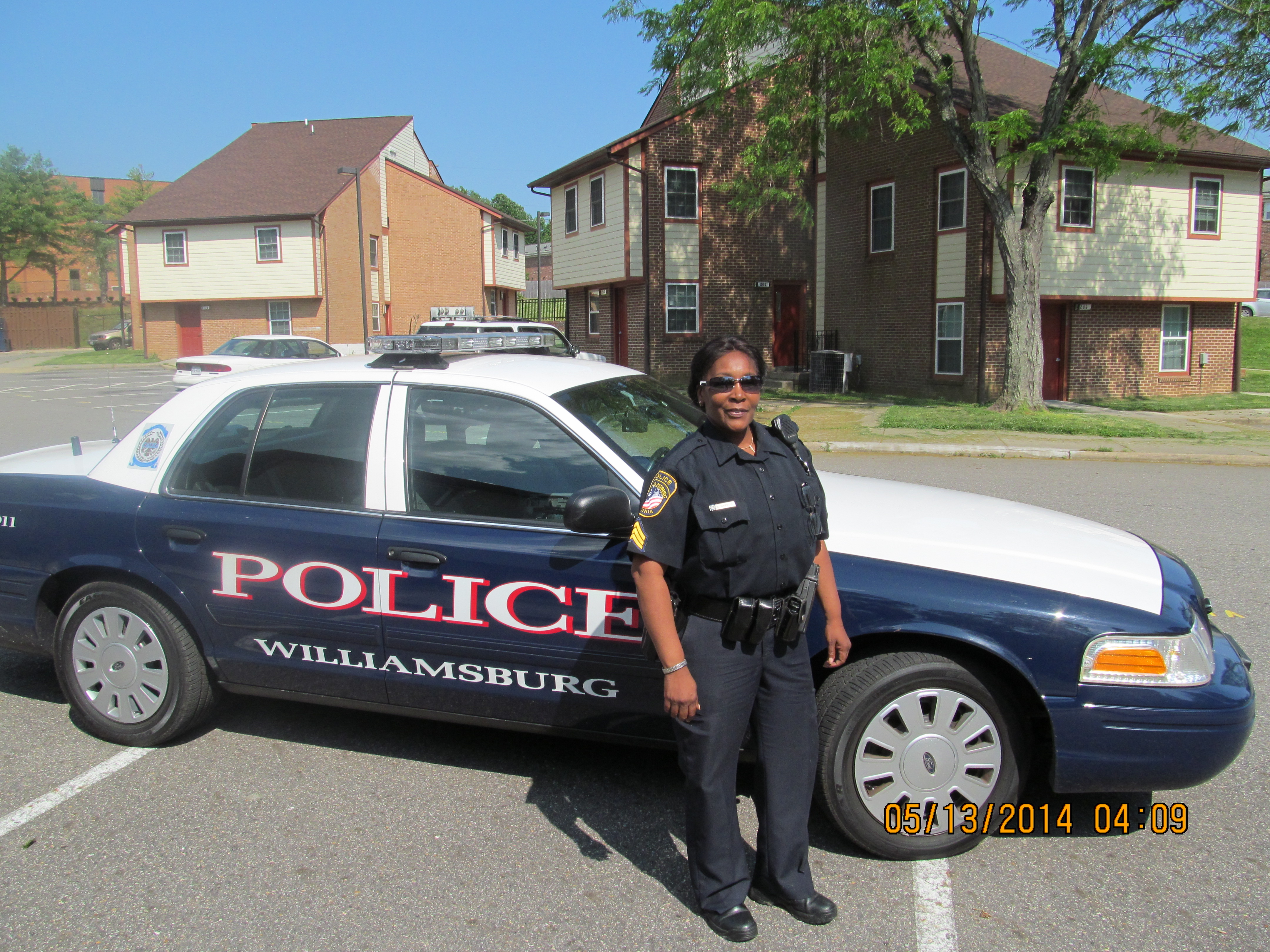 Sgt. Kim Hamilton of the Williamsburg PD drives through a housing complex: “Criminals know you can try to come through [Williamsburg]—but we’ll catch you.” (Photo: Kristine Meldrum Denholm)