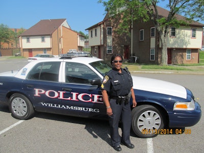 Sgt. Kim Hamilton of the Williamsburg PD drives through a housing complex: “Criminals know you can try to come through [Williamsburg]—but we’ll catch you.” (Photo: Kristine Meldrum Denholm)