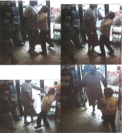 Surveillance video stills reportedly show a strong-arm robbery in a Ferguson, Mo., convenience store. Michael Brown was, according to police reports released today, a suspect in the robbery. Minutes after the incident in the store, Brown was shot and killed by a Ferguson police officer. (Photo: Ferguson PD)