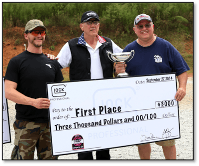 Clifton Collins, Jr. and The 'Gunny' present the first place prize of $3,000 to 'MatchMeister' winner Butch Barton – a five-time GSSF match champion. Photo: Glock