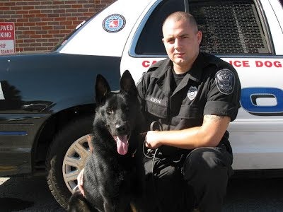 Handler Officer Chris Alberini with Dax (Photo: Ashland (Mass.) PD)