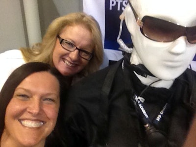 Police National Sales Manager Susan Freel (foreground) and Publisher Leslie Pfeiffer take a selfie in the Police SHOT Show booth (#11979) next to a mannequin wearing ESS Eye Pro eyewear.