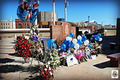 Flowers placed at the cleaned-up Denver Fallen Officer Memorial. (Photo: Denver PD via Facebook)