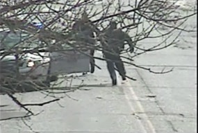 Still image from official Baltimore surveillance video shows man charging at officer right before officer opened fire.