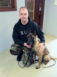 K-9 Karson reunited with his handler Officer Jerry Popp. After 61 days lost, the dog was 14 pounds lighter and mildly dehydrated but otherwise healthy. (Photo: Wilmington (Ohio) PD)
