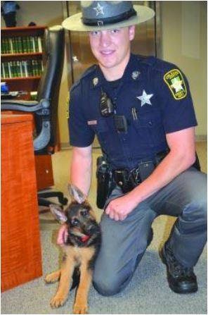 K-9 Kilo from the Orleans County Sheriff's Office, seen here as a puppy with his partner, Deputy Tyler Jacobs. (Photo: Facebook)