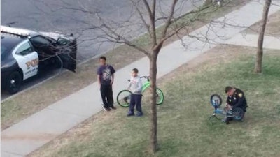 Officer Cody Remy saw a child working on his broken bike and stopped to help. (Photo: WFSB)