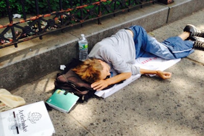 Homeless man sleeping on the street in New York City. (Photo: SBA via Flicker)