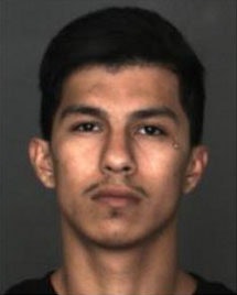 Issac M. Ornelas, 21, of San Bernardino, is accused of fleeing officers, exiting his vehicle, and then pulling out a gun. A pursuing officer, in fear of his safety, ran over Ornelas. He is expected to survive. (Photo: San Bernardino PD)