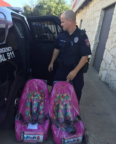 Instead of ticketing the father, two Cedar Park police officers bought him three car seats. (Photo: Cedar Park PD)