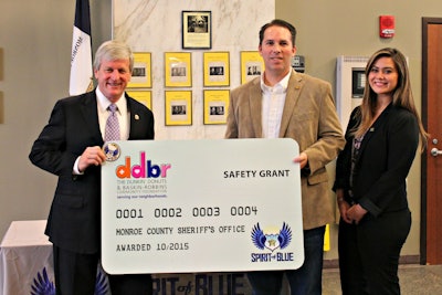 Sheriff Patrick O'Flynn (left) accepted the Safety Equipment Grant at a ceremony held at the Monroe County Sheriff's Office Headquarters in Rochester, NY. Presenting the grant was Ryan T. Smith, Executive Director of the Spirit of Blue Foundation, and Abbey Celeste, Field Marketing Manager from Dunkin' Brands.