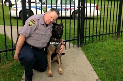 Officer Matthew Hickey served as Ajax's handler for three years. (Photo: Facebook)