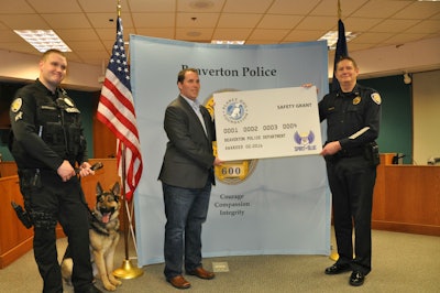 Spirit of Blue presented a $2,500 grant to the Beaverton (OR) Police Department for the acquisition of a new K-9 working dog, sponsored by the Planet Dog Foundation. The grant was presented by Ryan T. Smith of Spirit of Blue (center) and was received by (left to right) Officer Matt Barrington, K-9 Atlas, and Chief Geoff Spalding.
