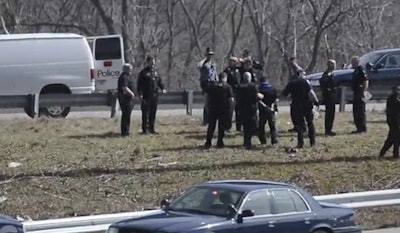 Officers take a bank robbery suspect into custody following a chase from Kansas into Missouri. (Photo: Screen shot from Kansas City Star video)